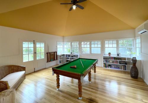 a living room with a pool table in it at Phillip Island Coastal Cabins in Sunderland Bay