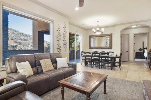 a living room with a couch and a table at Sierra Sky - Patio with fireplace in Hurricane