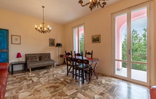 a living room with a table and a couch at Awesome Home In Capolona in Capolona