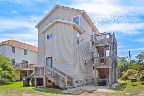 a large house with two balconies on it at 1702 - Sandpiper Lookout in Poplar Branch