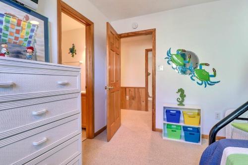 a bedroom with a dresser and a bedroom with a bed at 2015 - Makai in Sanderling