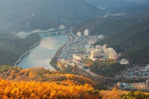 an aerial view of a city next to a river at Sono Belle Danyang in Danyang