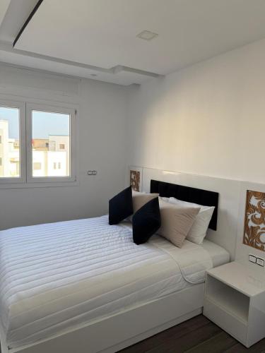 Postel nebo postele na pokoji v ubytování Luxury Apartment in Martil
