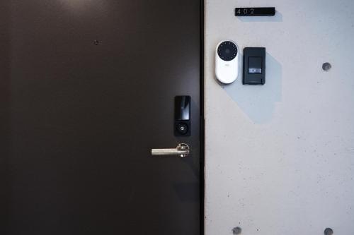 a close up of a door with a key at ZAITO Waseda Terra Hotel in Tokyo