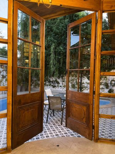 an entrance to a house with glass doors at Boutique Hotel Premium Vendimia in Santa Cruz