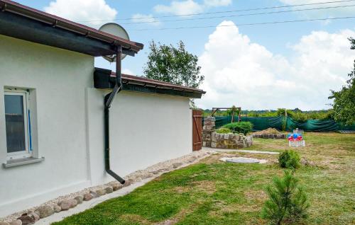 a house with drainage pipes on the side of it at Pet Friendly Home In Maszewo With Wifi in Maszewo