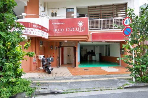 a hotel lobby with a motorcycle parked in front of it at cuculu MAEJIMA 4F in Tomari