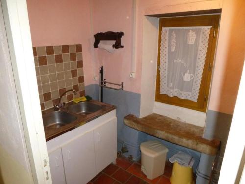 a small bathroom with a sink and a toilet at Maison de campagne confortable avec jardin, barbecue et cheminées - proche de Vichy et activités karting - FR-1-489-170 in Montoldre