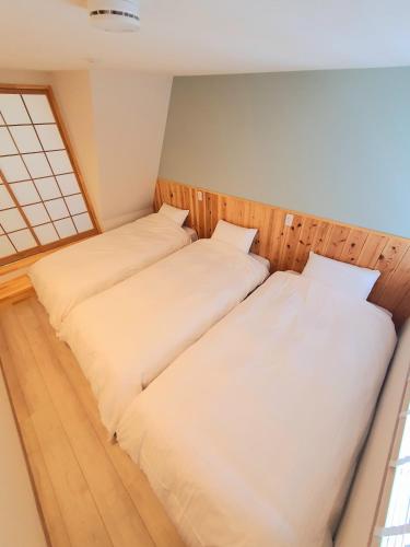 Postel nebo postele na pokoji v ubytování 尾道小路 - onomichi komichi - Supported by COCOSTAY