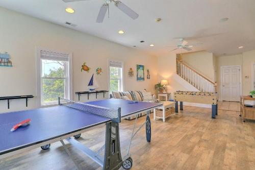 a living room with a ping pong table in it at 7076 - JMJ Seascape in Nags Head