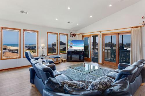 a living room with a couch and a tv at 7088 - Short II in Grun Island