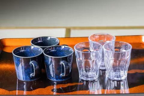 a group of glass cups sitting on a table at SAMURAI Base in Hakone