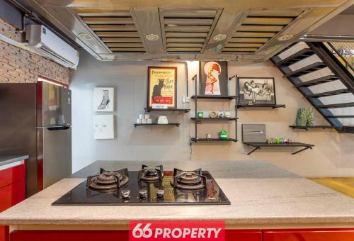 a kitchen with a stove top in a room at Chic Townhouse in Old City in Chiang Mai
