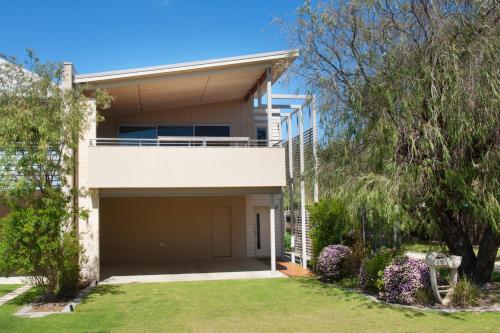 a house with a large garage in a yard at Dunsborough Seascape in Quindalup