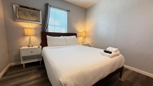 a bedroom with a large white bed and two lamps at Budget-friendly Studio In Okcprivate Entry#20-3 in Oklahoma City