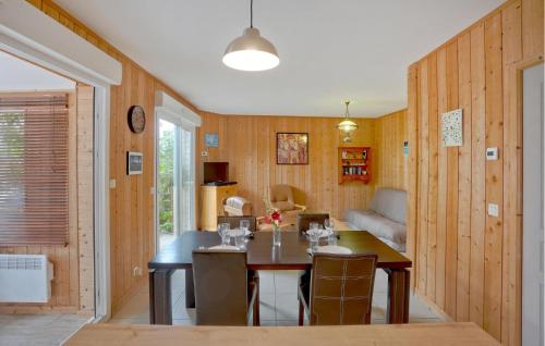 a dining room with a table and chairs in a room at Nice Home In Créances With Wifi in Créances