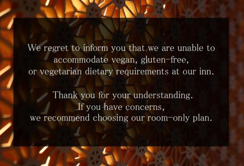 a sign that says we regret to inform you that we are unable to accomplish vegetarian at Nakajimaya Ryokan in Nozawa Onsen