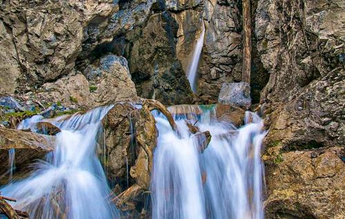 a group of waterfalls on the side of a mountain at Ferienhaus Dalaas Am Arlberg in Dalaas