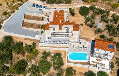 an aerial view of a mansion with a pool at Hotel Liberan - Nature's Retreat in Podgora