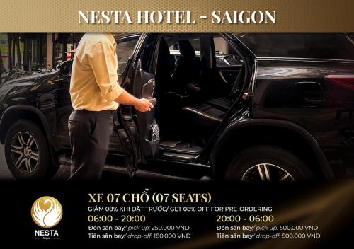 a man is getting out of a car at Nesta Hotel Saigon in Ho Chi Minh City