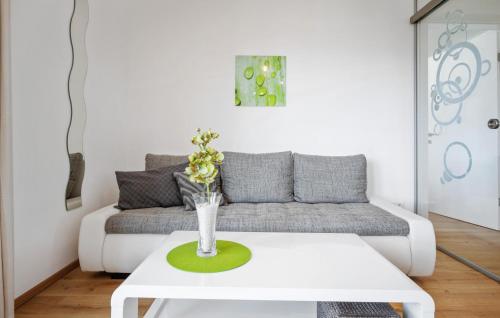 a living room with a couch and a table at Ferienwohnung Pörtschach in Pörtschach am Wörthersee