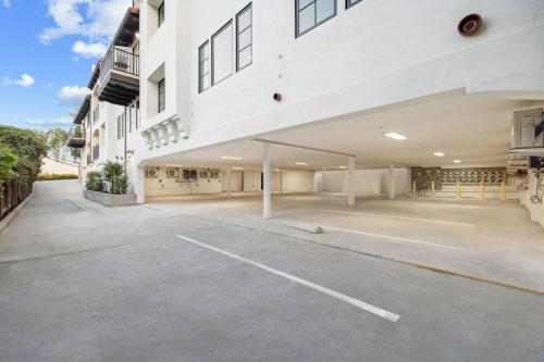 an empty parking lot in front of a building at Casa Riviera - Boutique Apartments in Downtown Santa Barbara in Santa Barbara