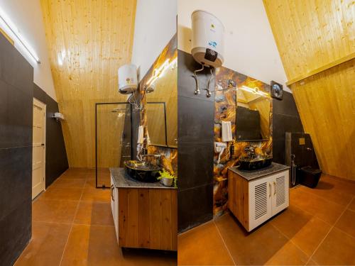 a bathroom with two sinks and a mirror at Patio Farms by Saltstayz in Farrukhnagar