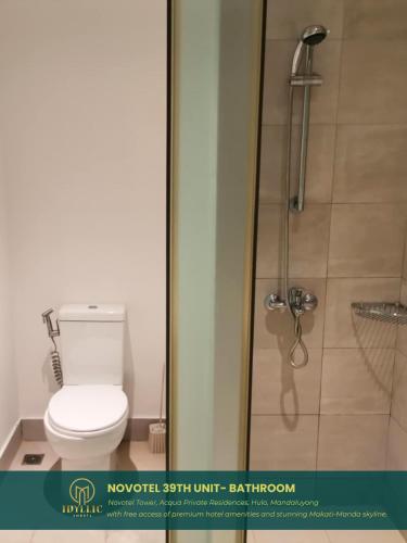 a bathroom with a toilet and a shower at Novotel Twin Bed at Mandaluyong Near Makati FREE pool in Manila