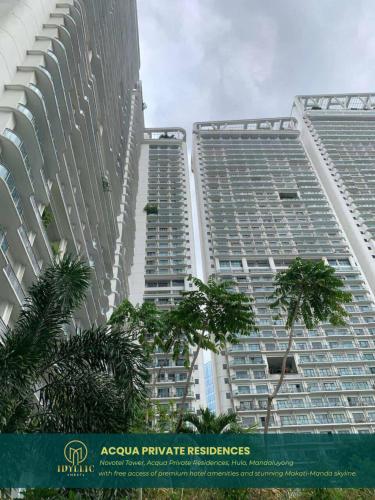 two tall buildings with palm trees in front of them at Novotel Twin Bed at Mandaluyong Near Makati FREE pool in Manila