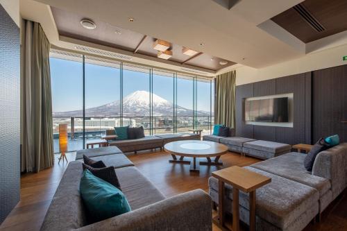 a living room with a view of a mountain at Ki Niseko in Kutchan