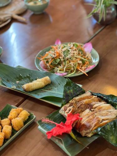 a table with three plates of food on it at Amazing Ninh Binh Garden in Xuân Sơn