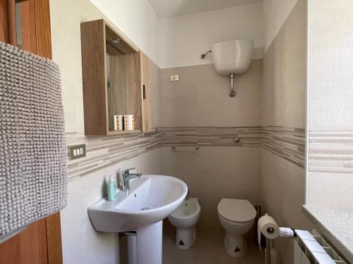 a bathroom with a sink and a toilet at Casa di Adele in Brittoli