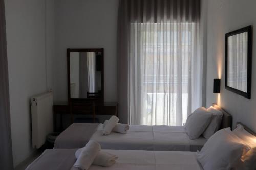 Katil atau katil-katil dalam bilik di Therma Hotel