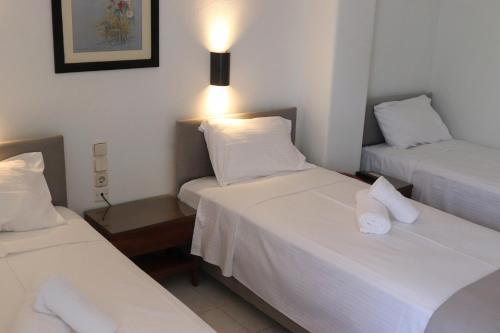 Katil atau katil-katil dalam bilik di Therma Hotel