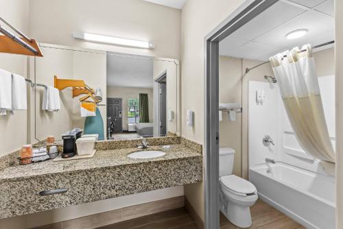 a bathroom with a sink and a toilet and a shower at Quality Inn Oak Grove Fort Campbell in Oak Grove