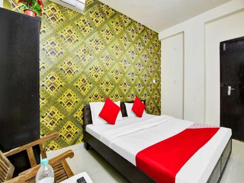 Ένα ή περισσότερα κρεβάτια σε δωμάτιο στο Hotel O VIVAAN RESIDENCY