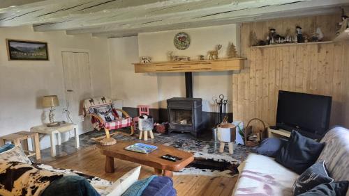 Χώρος καθιστικού στο Le CHALET AUX CERFS