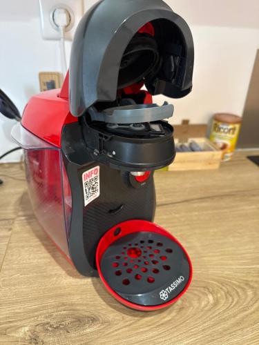 a black and red mixer sitting on a table at Chez Mamy in Martres-dʼArtières