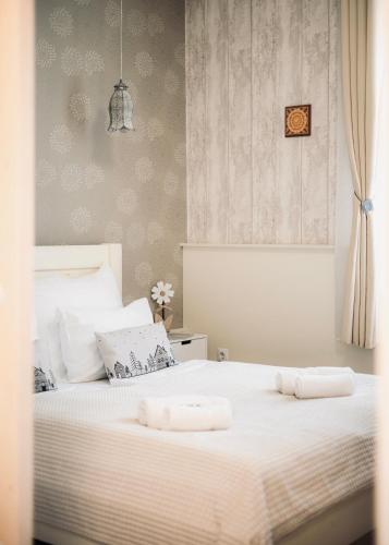 Un ou plusieurs lits dans un hébergement de l'établissement Safit Mandala - Romantic City Apartment near Flexum Thermal Spa
