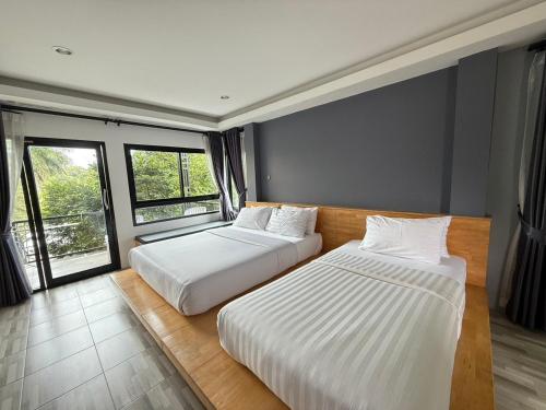 Postel nebo postele na pokoji v ubytování Sor Kor Sor Resort