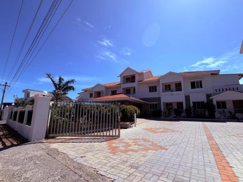 a fence in front of a house at Harish Beach Resort in Rāmeswaram
