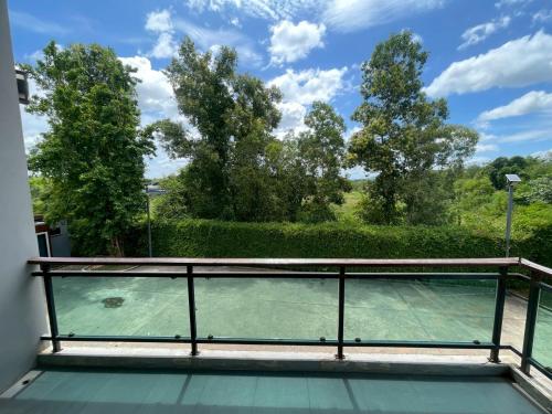 a view from the balcony of a tennis court at Nutchana Hill Boutique Hotel in Ban Thung Ri