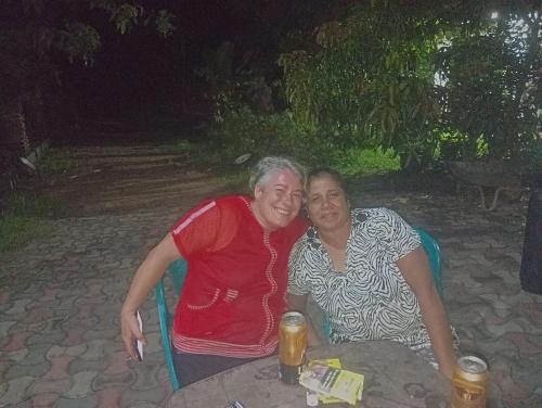 two older women sitting at a table at night at Alankulama Waana Resort in Anuradhapura