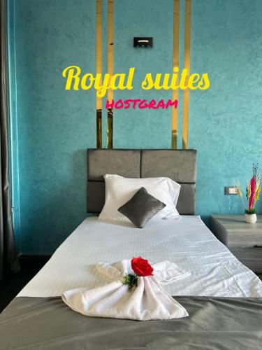 a hotel room with a bed with two towels at Garden City Suites EL Tahrir in Cairo