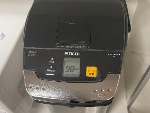 a weighing machine with a clock on the side of it at Hotel Morimotoya Itano - Vacation STAY 05548v in Kamiita
