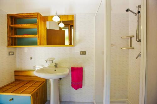 a bathroom with a sink and a shower at Residenz Moncucco in Luino