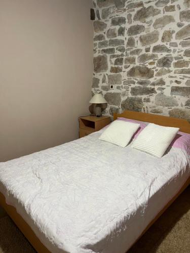 Ένα ή περισσότερα κρεβάτια σε δωμάτιο στο Apartman Poli Luce