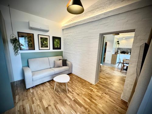 a living room with a couch and a table at Apartamenty Młyńska 3A in Gliwice