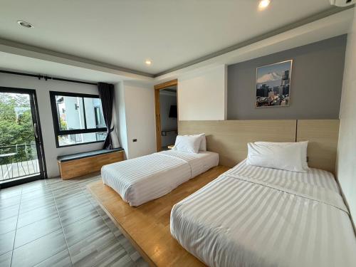 Postel nebo postele na pokoji v ubytování Sor Kor Sor Resort