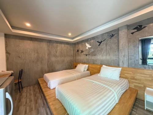 Postel nebo postele na pokoji v ubytování Sor Kor Sor Resort